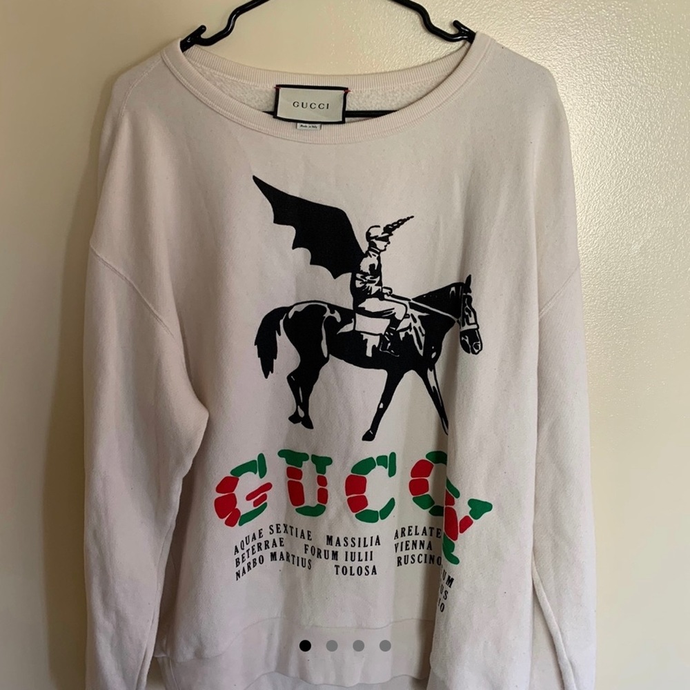 I’m selling a Medium Gucci “Guccy” sweater with a pegasus